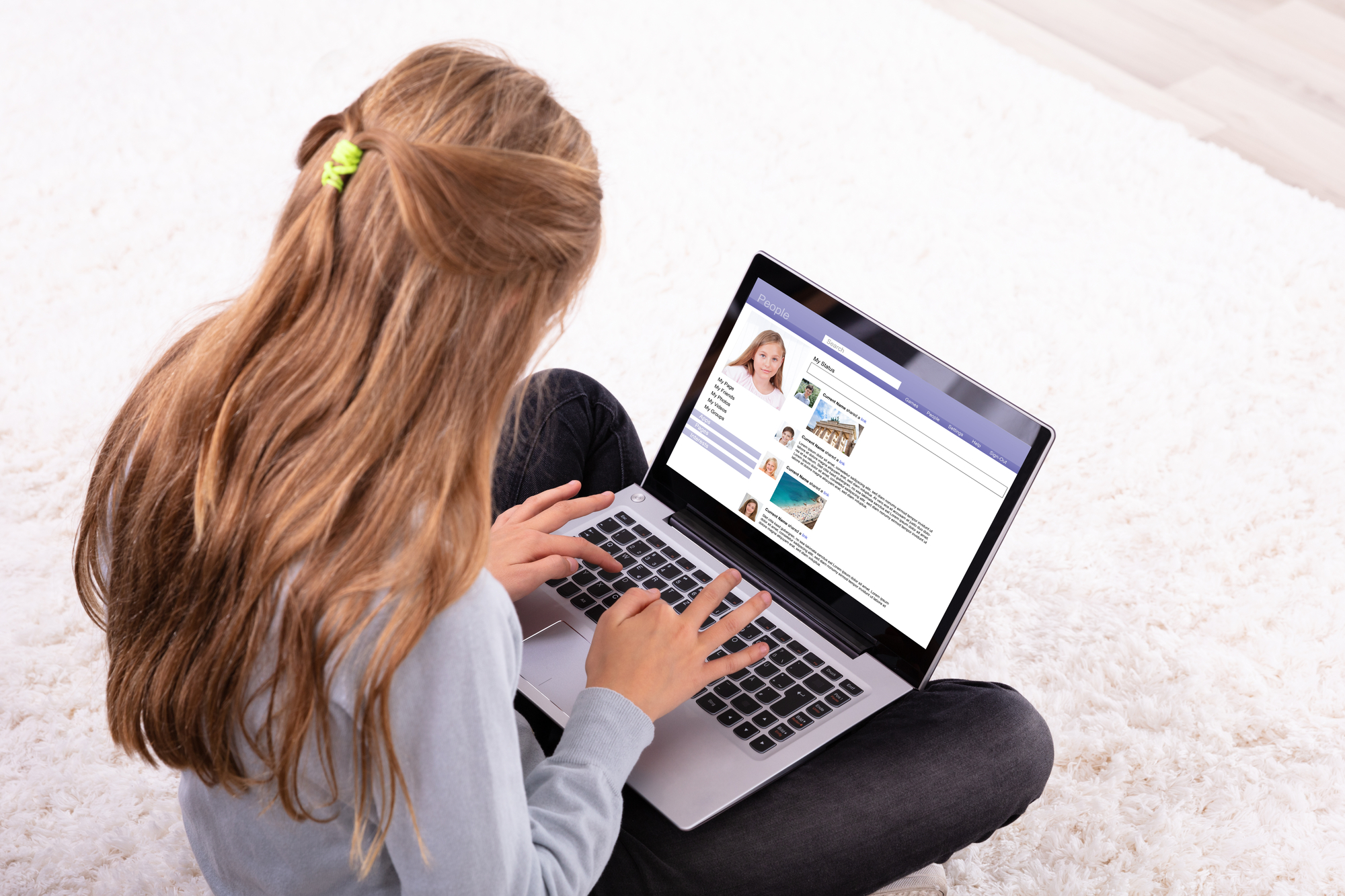 Girl using a social media service on a laptop